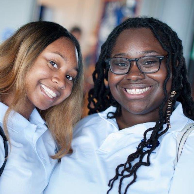 two smiling young women