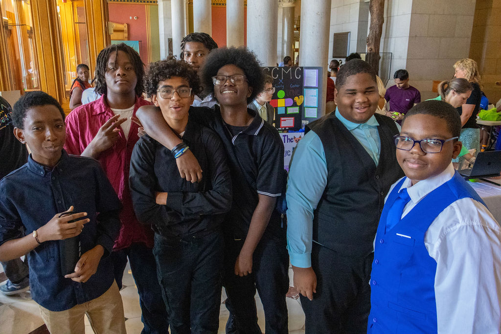Group of young men celebrating their summer internships
