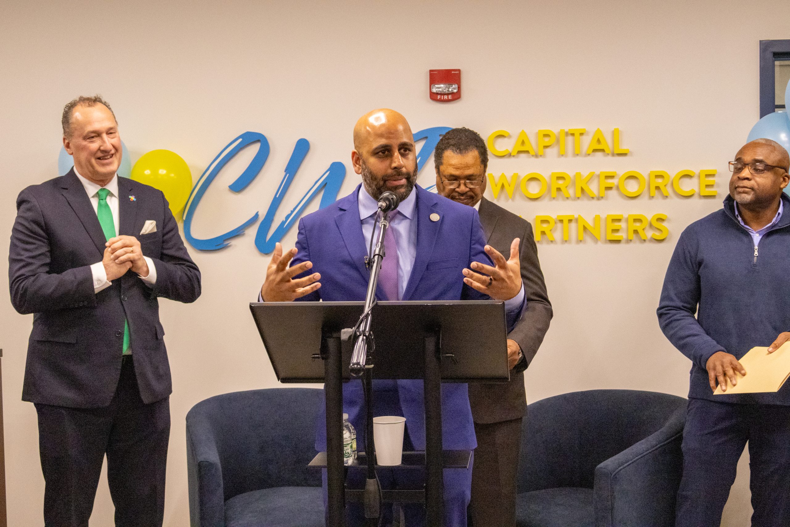 Hartford Mayor at a podium, speaking at the CWP Headquarters in Hartford