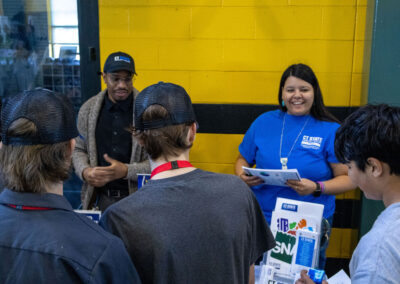 Group of jobseekers engaging with two employers at TDL Career Fair