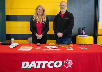 Two New Britain TDL Employers standing behind a table at TDL Career Fair