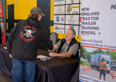 Young man shaking hands with a hiring manager at TDL Career Fair