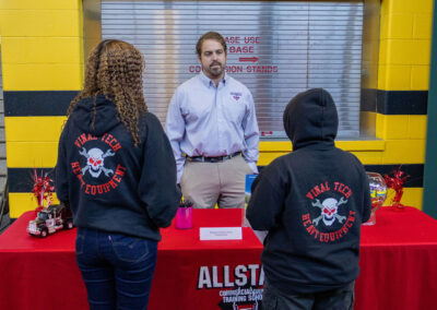 Two students talking to a TDL Hiring Manager at TDL Career Fair