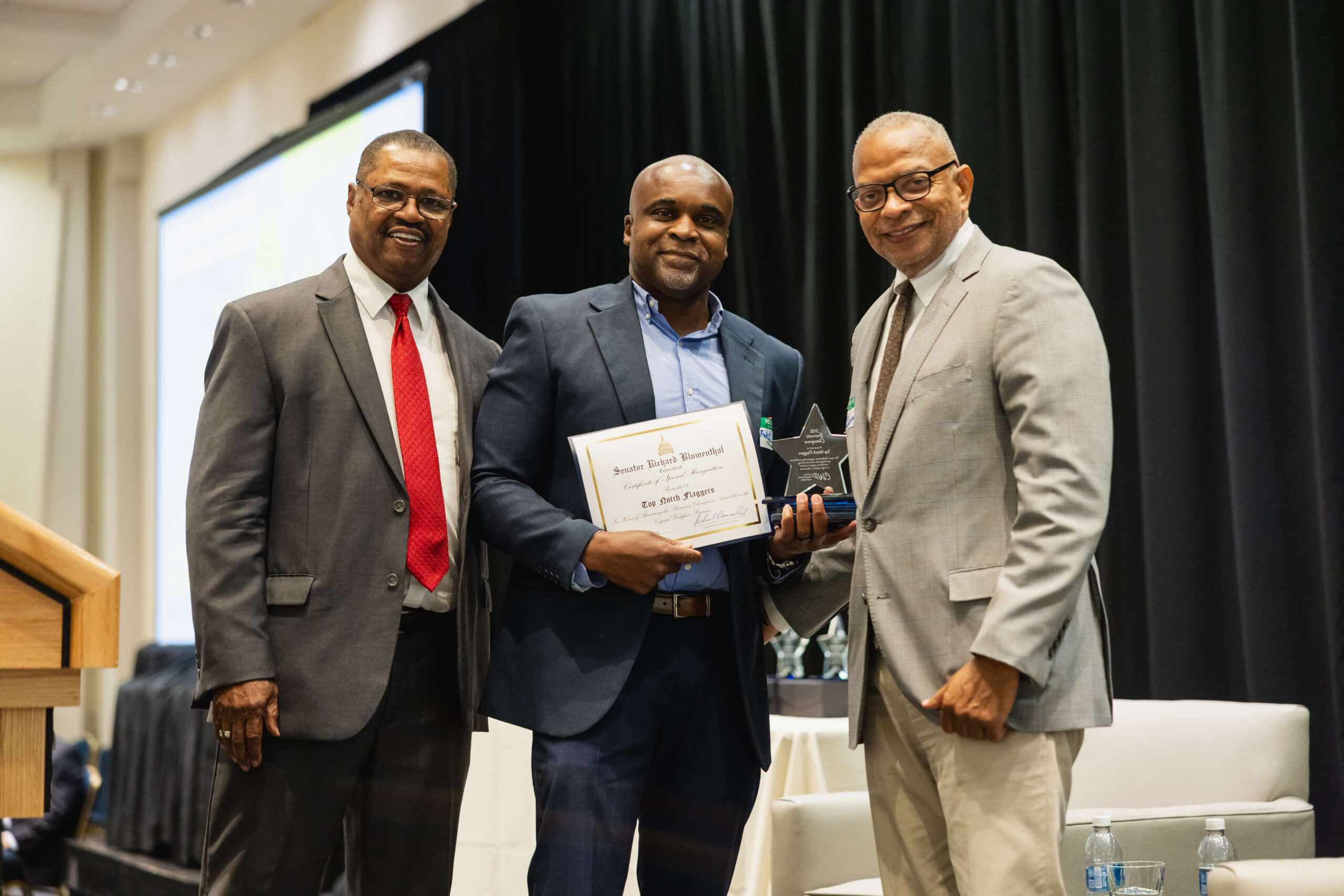 Top Notch Flaggers owner accepting award at 2026 CWP Annual Meeting with CWP leadership by his side.