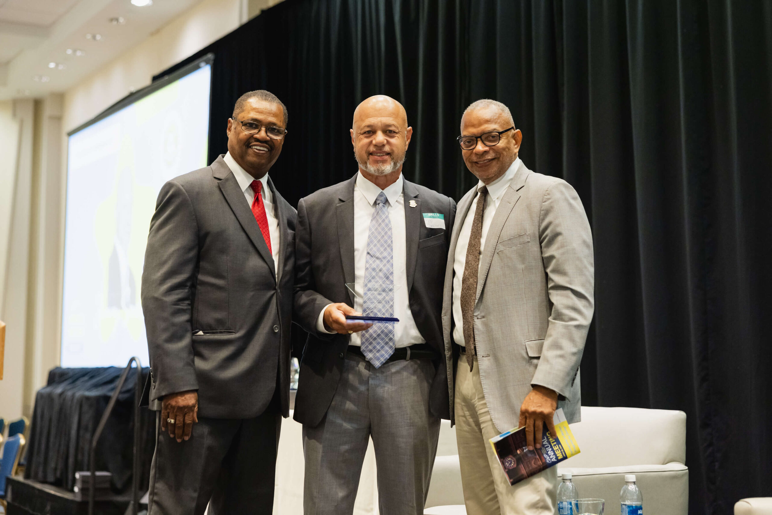 CT State Rep James Sanchez accepting award at CWP 2026 Annual Meeting, with CWP leadership on each side.