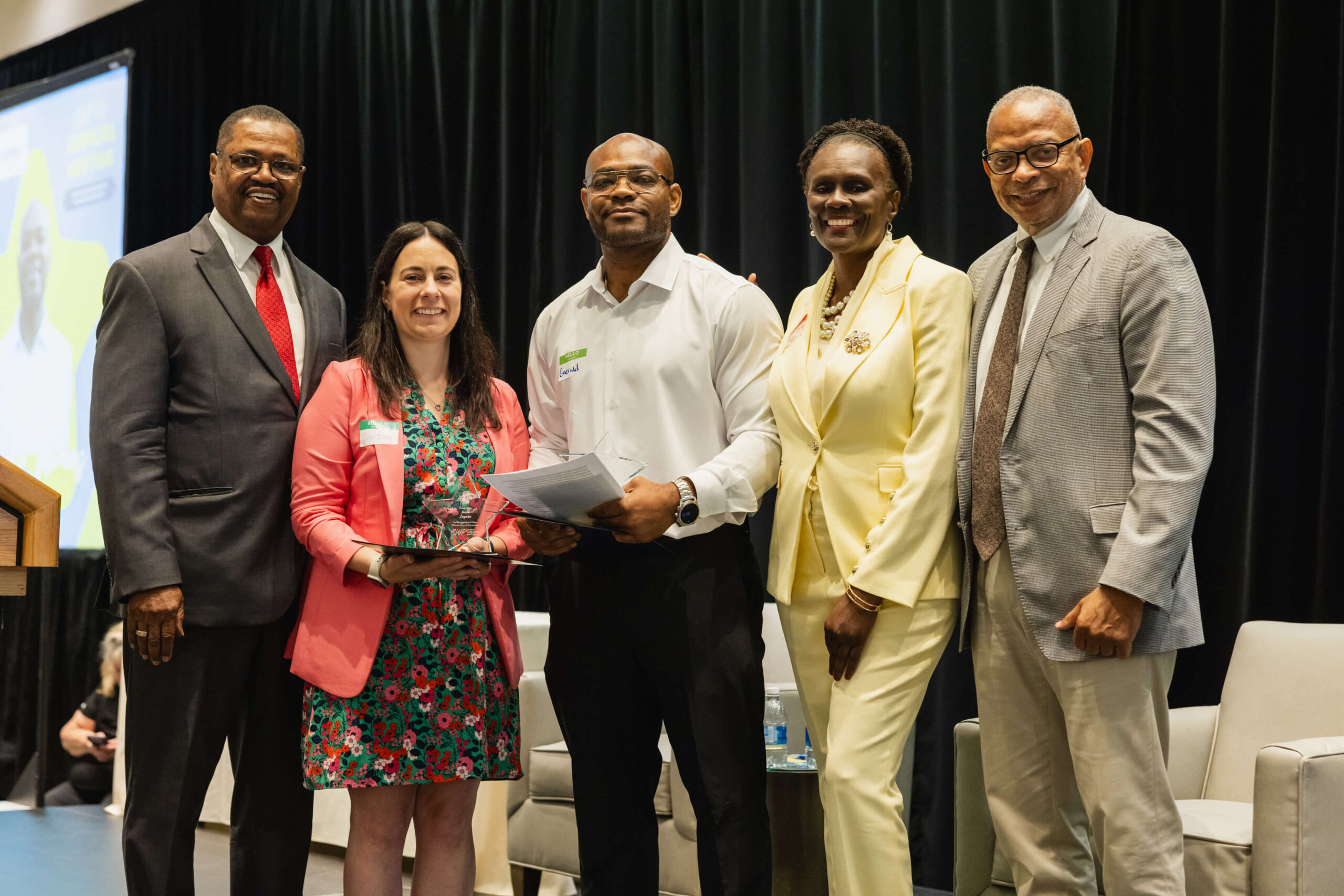 CT Jobseeker accepting award in hartford at CWP 2026 Annual Meeting, with CWP Leadership by his side.
